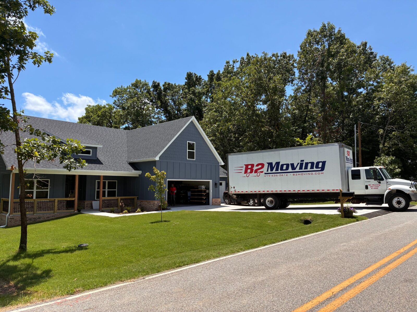 B2 moving truck positioned at a Bella Vista home while the crew gets set up for the move