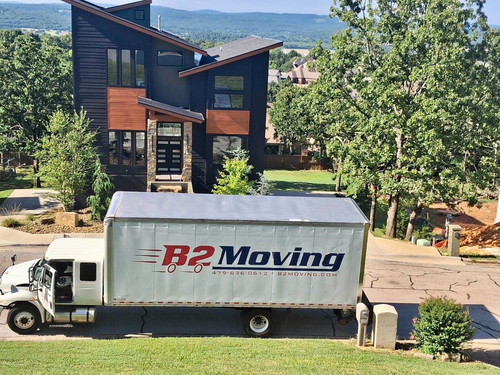 B2 Moving truck at a Fayetteville home overlooking the Ozark Mountains