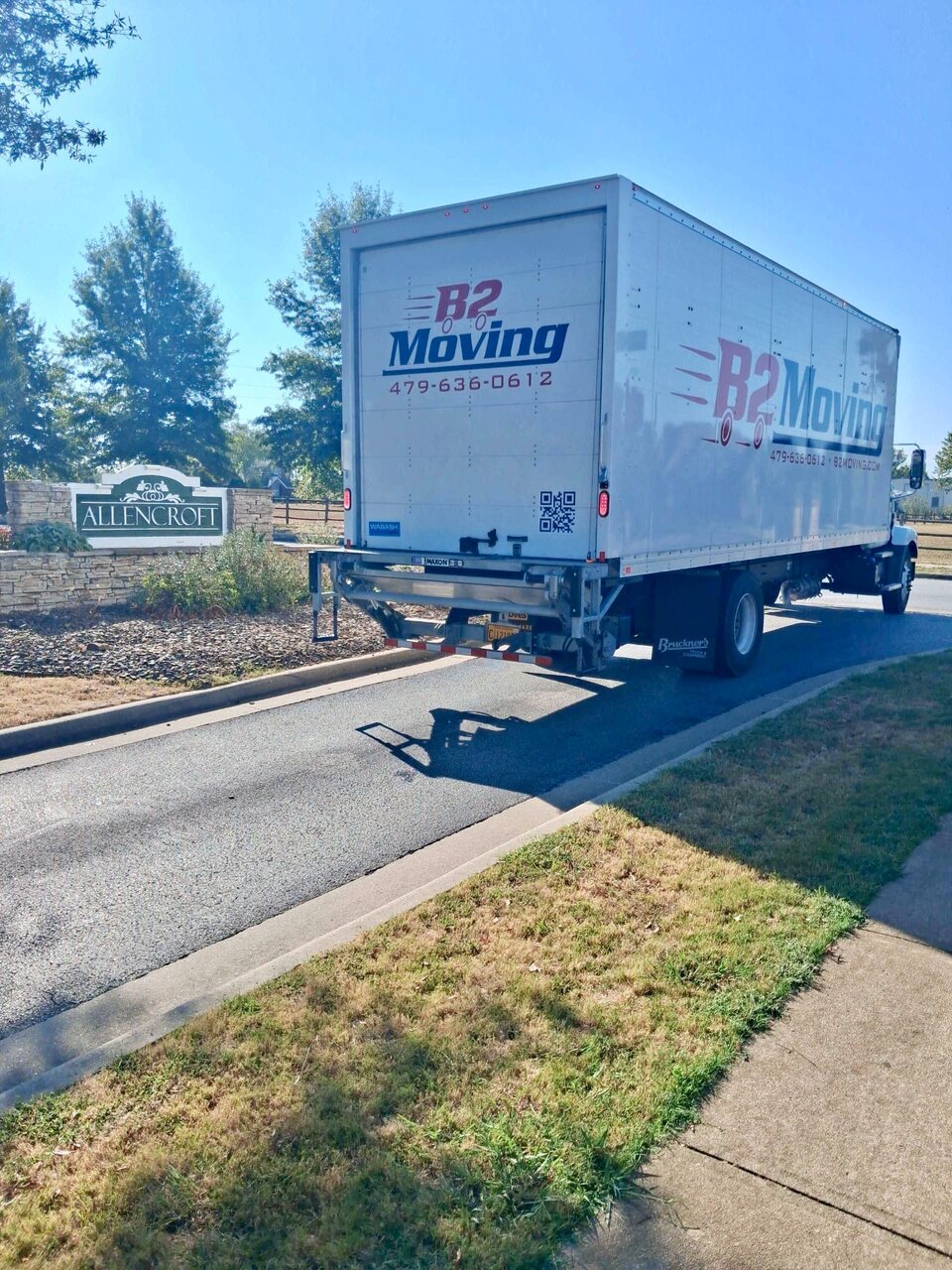 B2 Moving box truck beside the Allencroft neighborhood entrance in Centerton, Arkansas