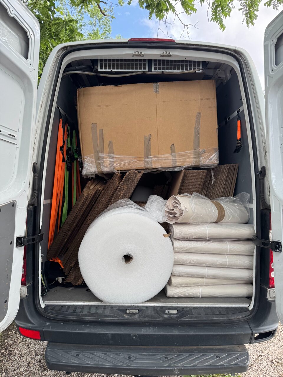 B2 cargo service van loaded with professional packing materials