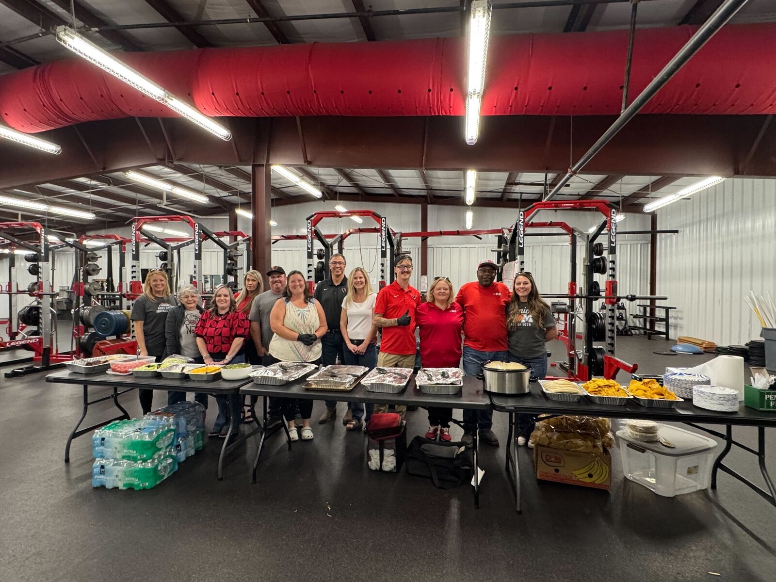 Jill and Jesse with Pea Ridge school staff and volunteers after serving the football team