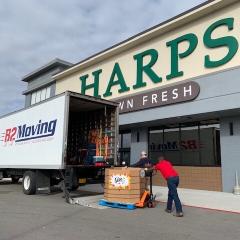 Jesse and Sam loading Harps food-drive donations into a B2 Moving truck