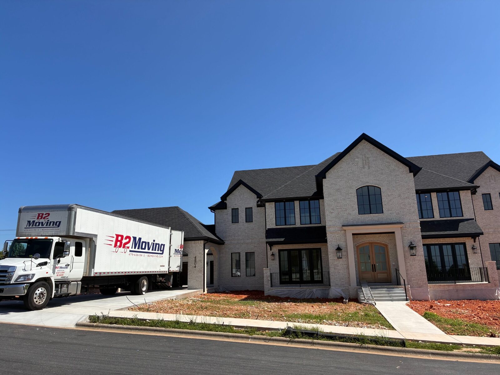 B2 Moving truck Truck Norris at a new home in Southgate Estates in Rogers, Arkansas