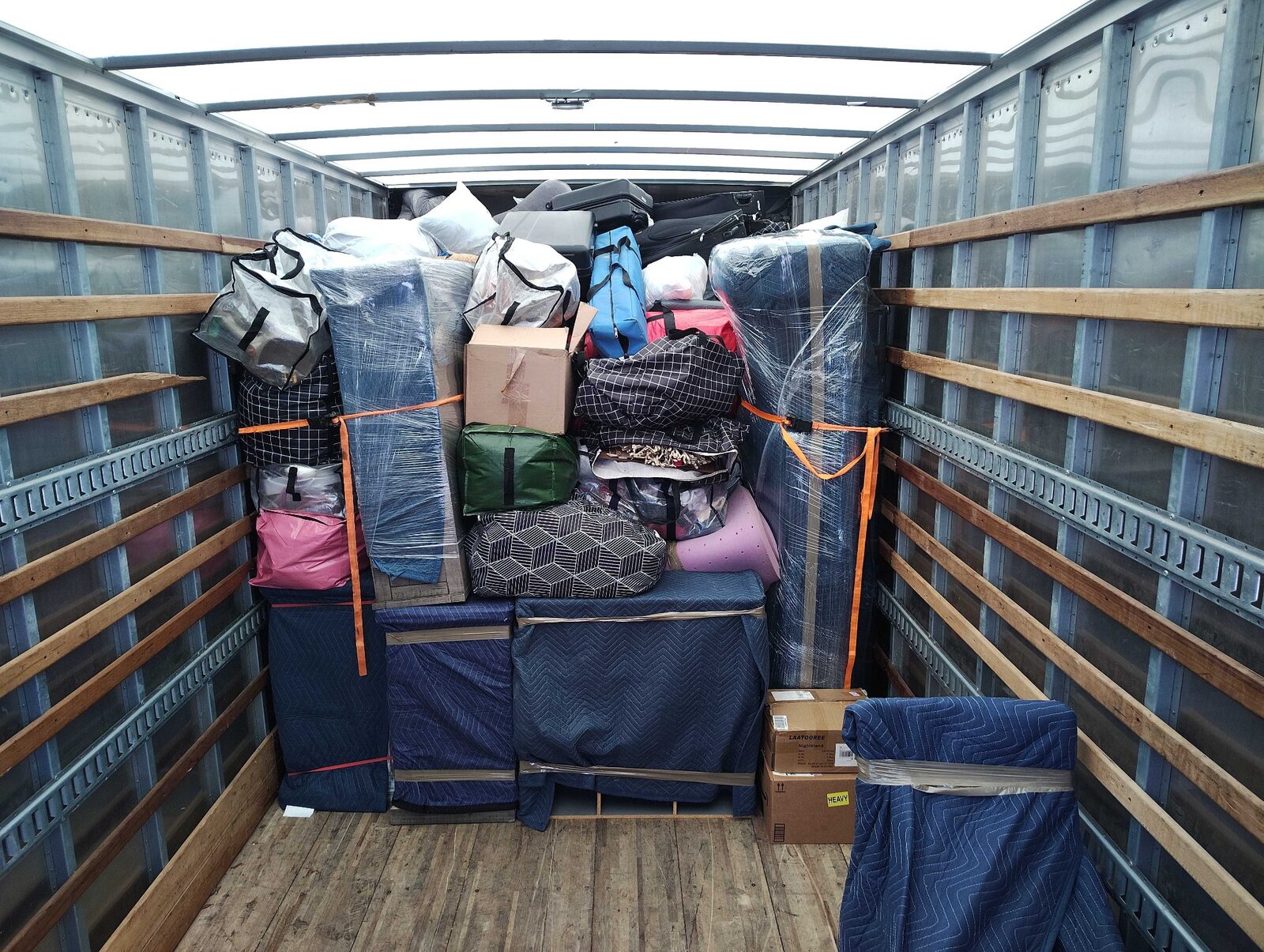 Furniture wrapped, tightly stacked, and secured inside a B2 Moving truck